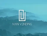 Un logotipo para Ivan Vending con una montaña en el fondo.