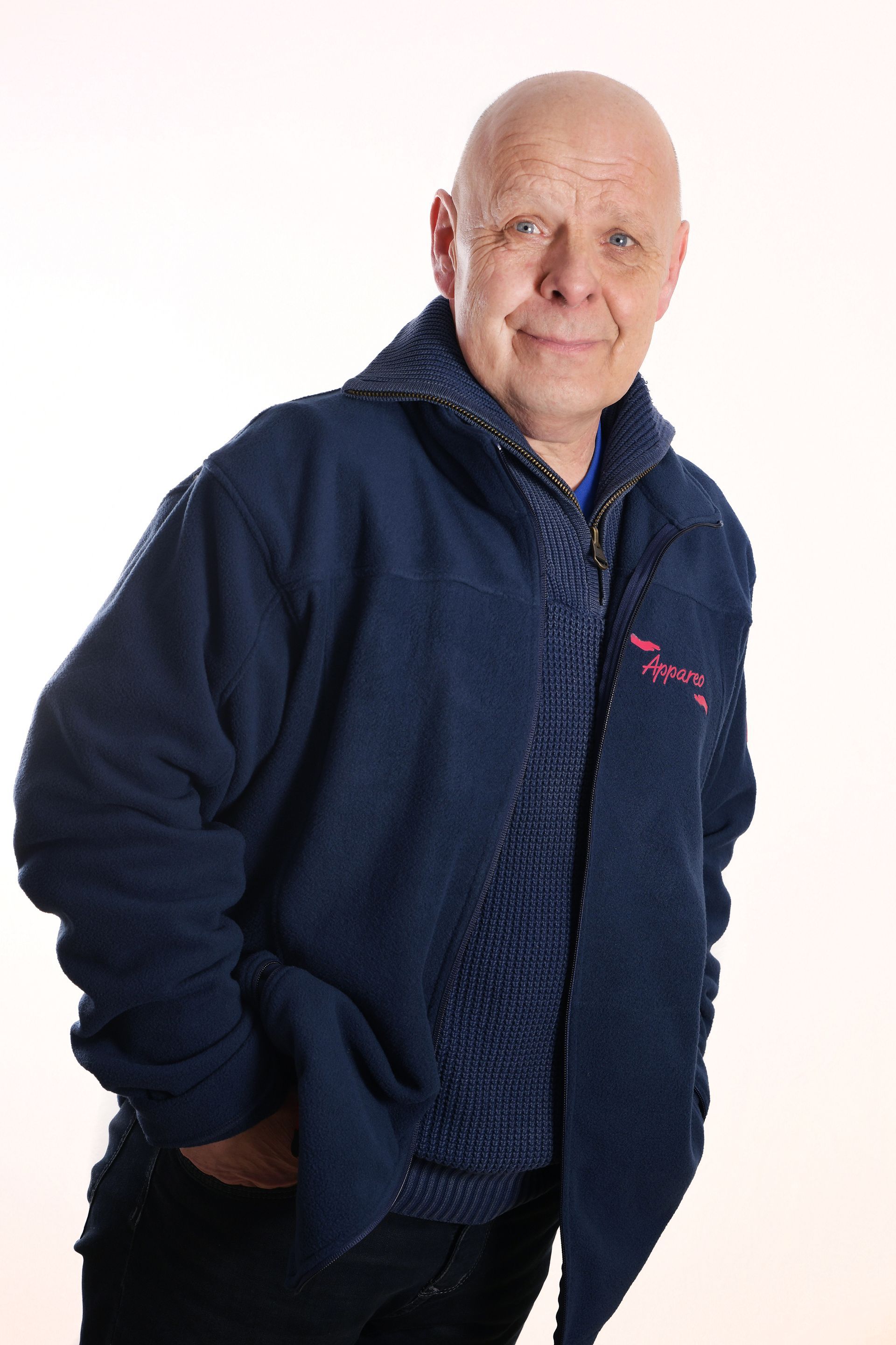 Porträt des Servicefahrers Reiner mit Glatze und einem freundlichen, ruhigen Gesichtsausdruck.