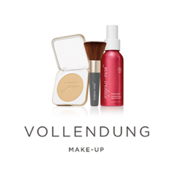 Eine Flasche Jane Iredale Make-up ist neben einem Puder und Pinsel