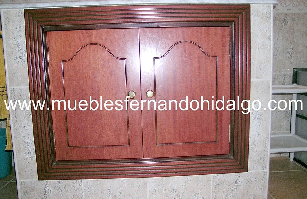 Una imagen de un mueble con la pagina web www.mueblesfernandohidalgo.com