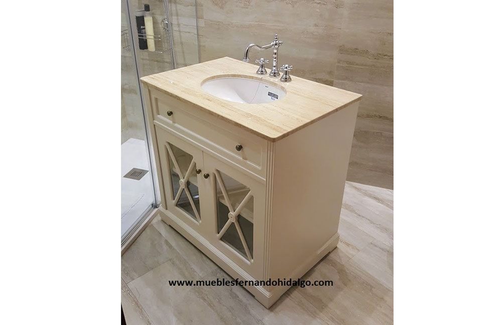 Un tocador de baño con lavabo y grifo.