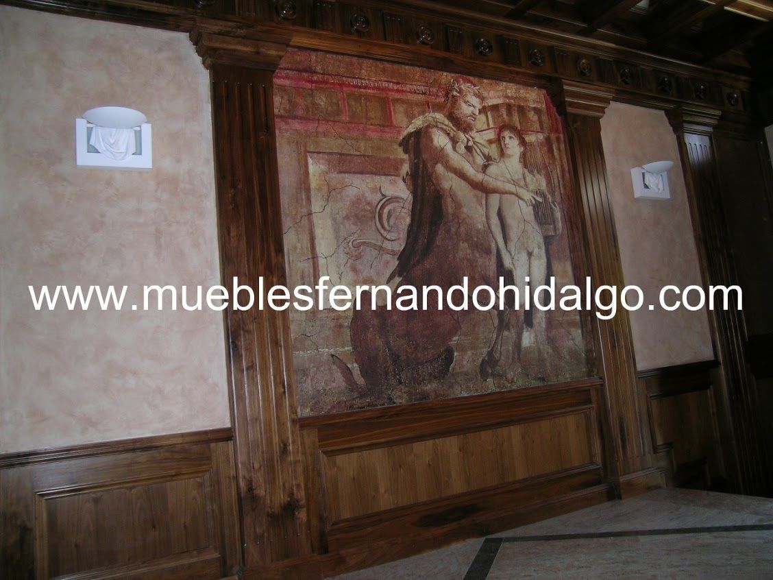 Un cuadro en una pared con la pagina web www.mueblesfernandohidalgo.com