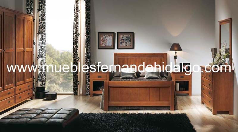 Un dormitorio con cama y cómoda con la web www.mueblesfernandohidalgo.com