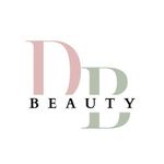 Logotipo para DD Beauty: letras D y D en rosa suave y verde, con "BEAUTY" debajo en negro.