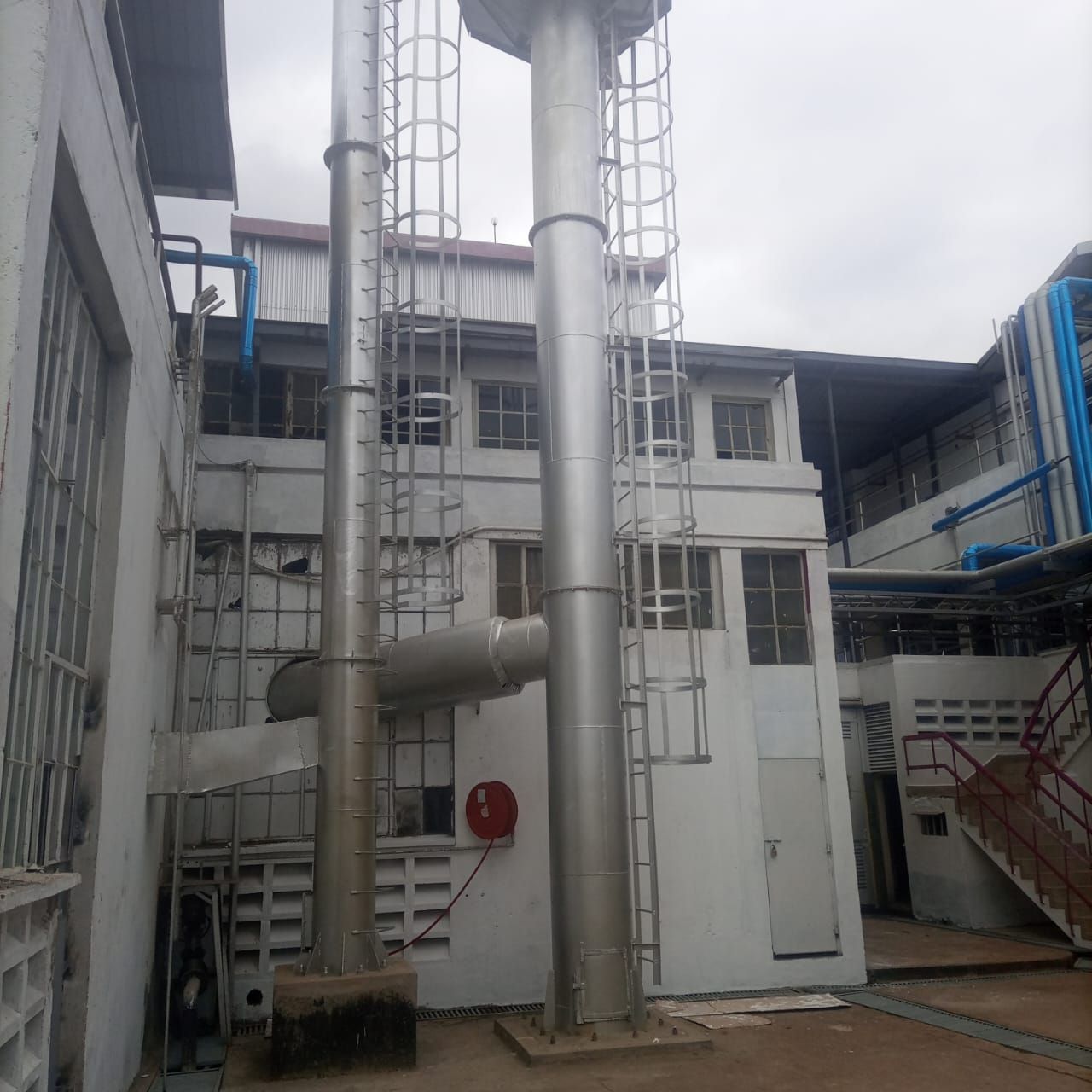 A building with a lot of pipes coming out of it