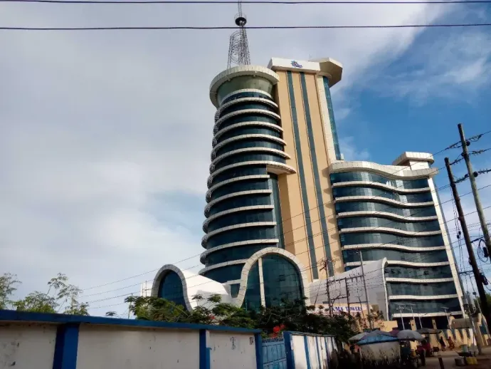 A tall building with a blue sky in the background