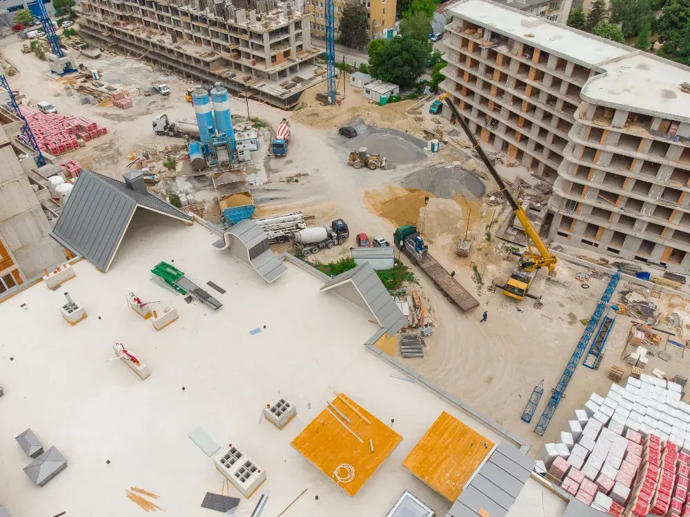 An aerial view of a construction site with a lot of buildings being built.