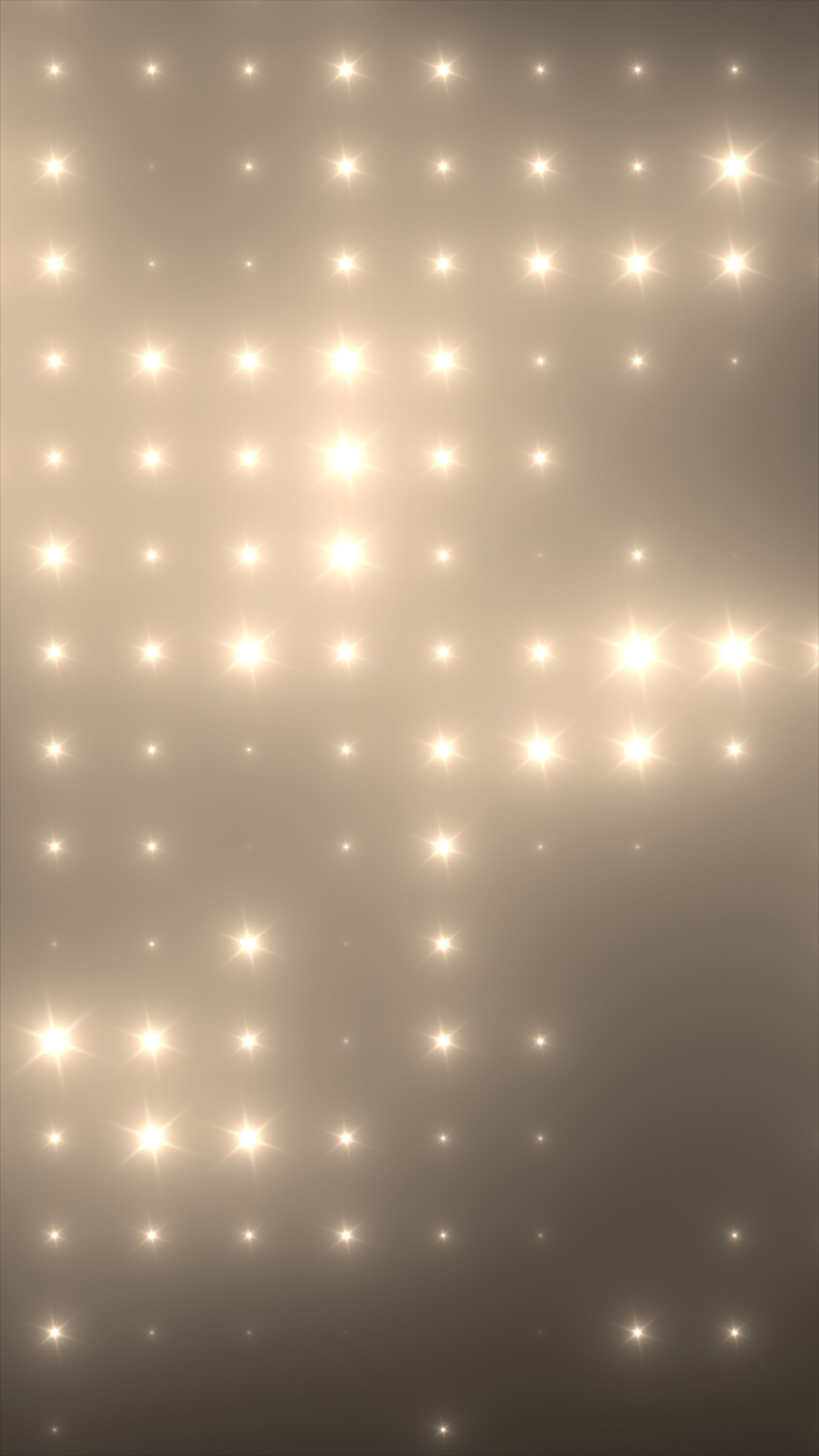 Grille de projecteurs aux tons chauds et lumineux sur un fond neutre et brumeux.