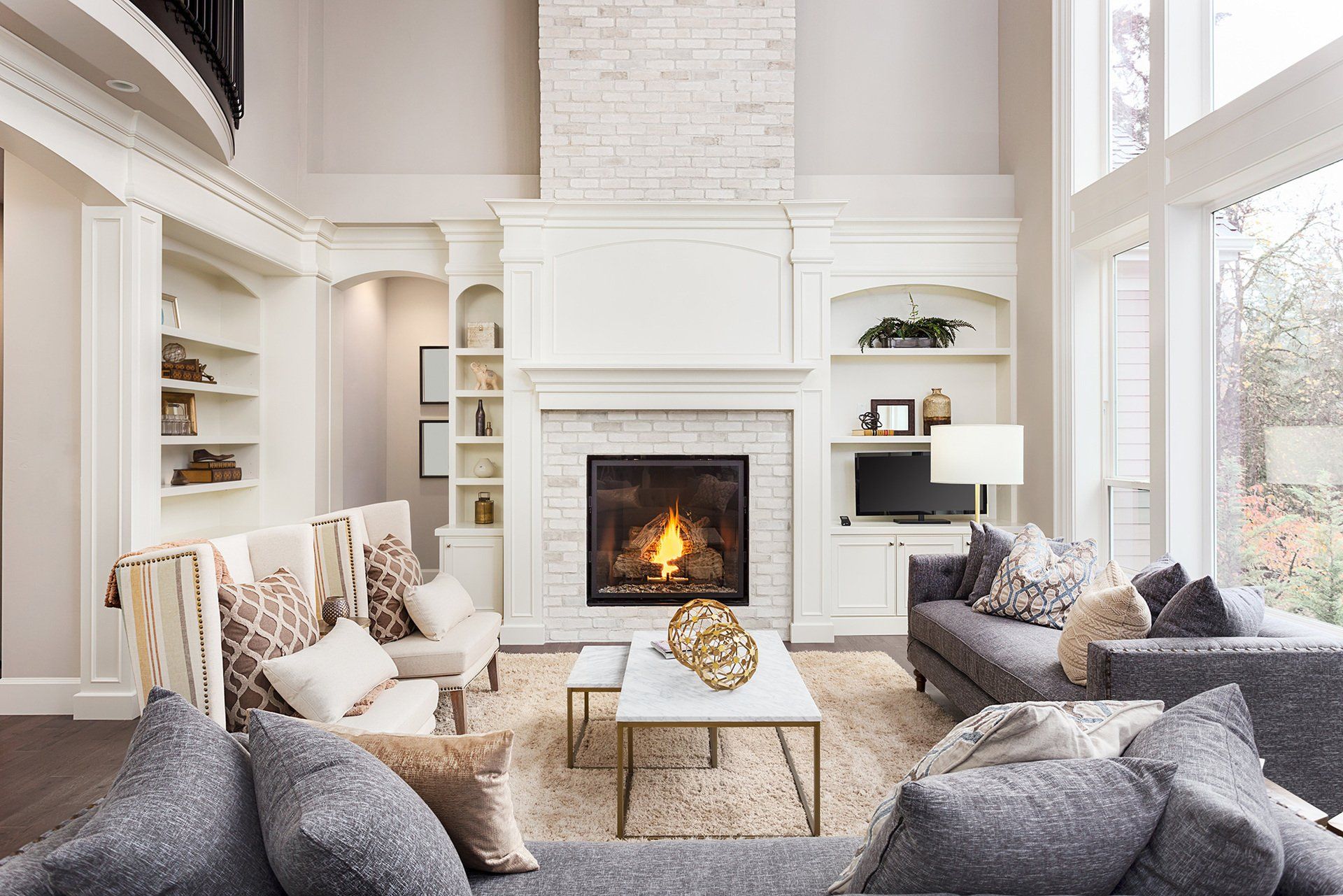 A living room filled with furniture and a fireplace.